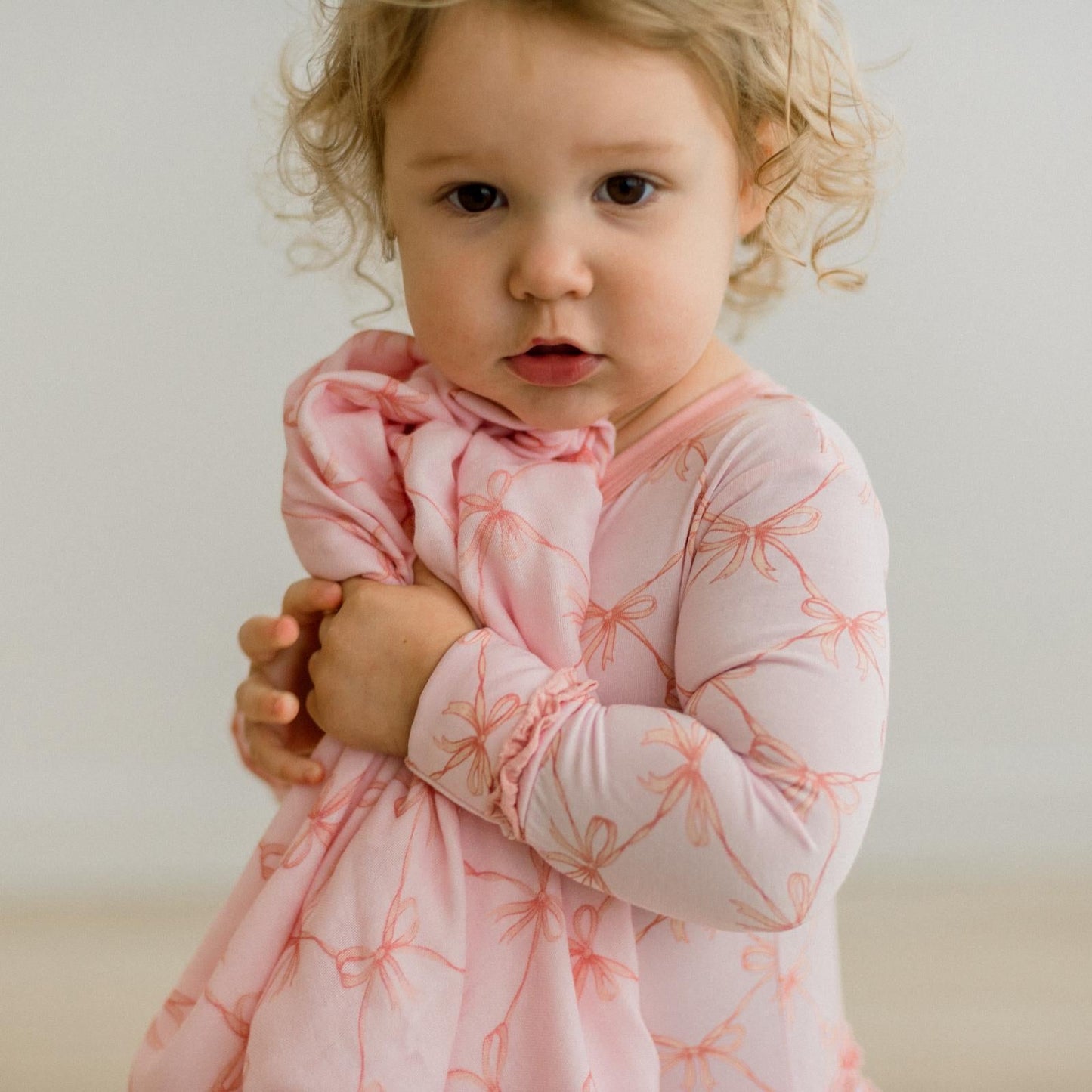 KicKee Shrinking Violet Bow Lattice | Print Dreamy Soft Muslin Swaddling Blanket