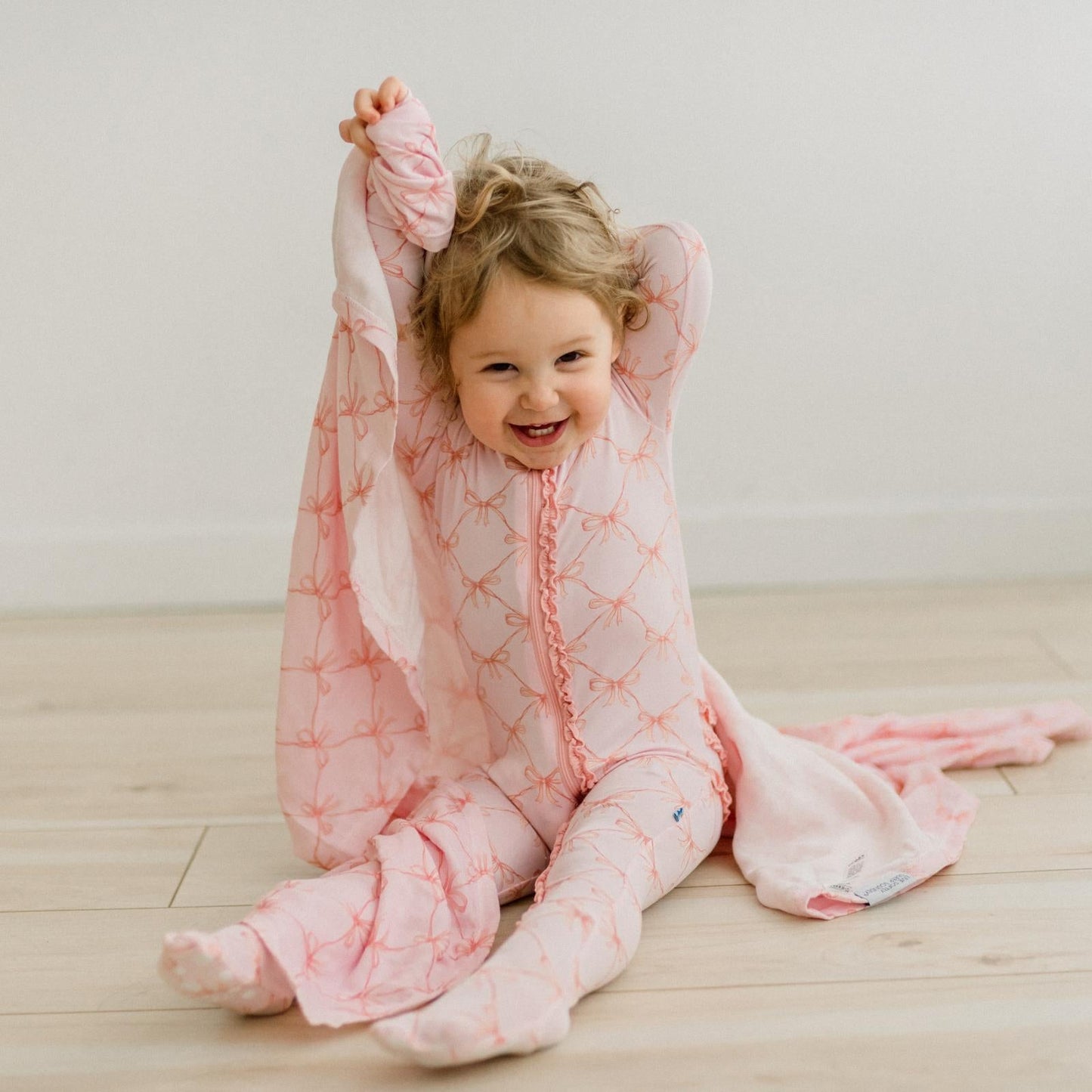 KicKee Shrinking Violet Bow Lattice | Print Dreamy Soft Muslin Swaddling Blanket
