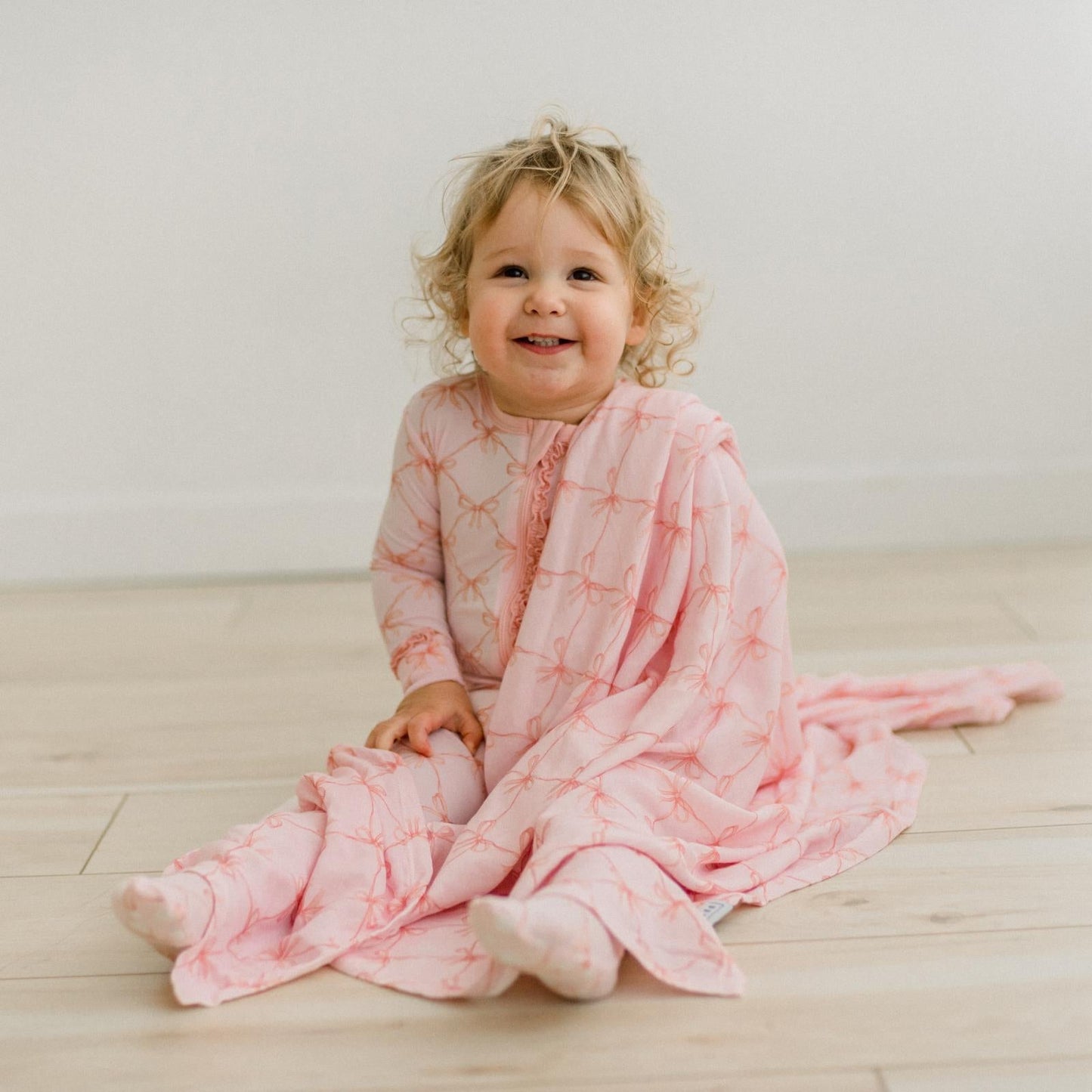 KicKee Shrinking Violet Bow Lattice | Print Dreamy Soft Muslin Swaddling Blanket